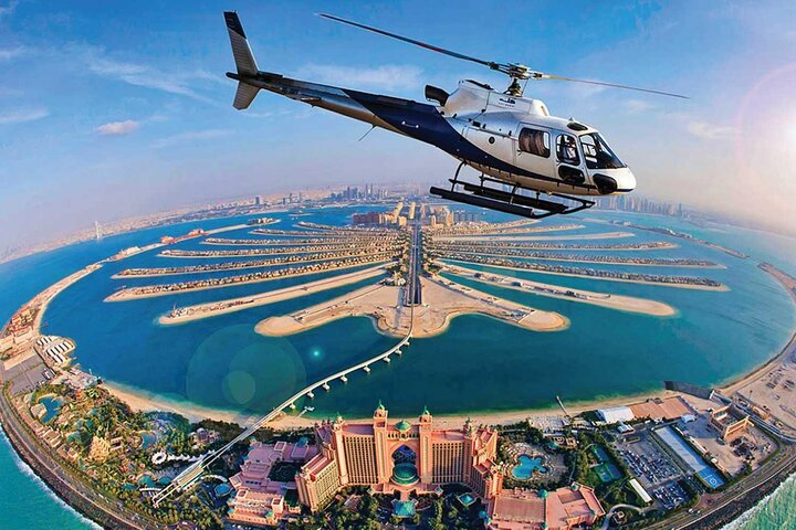 Experience Dubai from above with sweeping views of palm islands and iconic landmarks. Discover the stunning coastline and impressive architecture on an unforgettable helicopter adventure. Perfect for families!